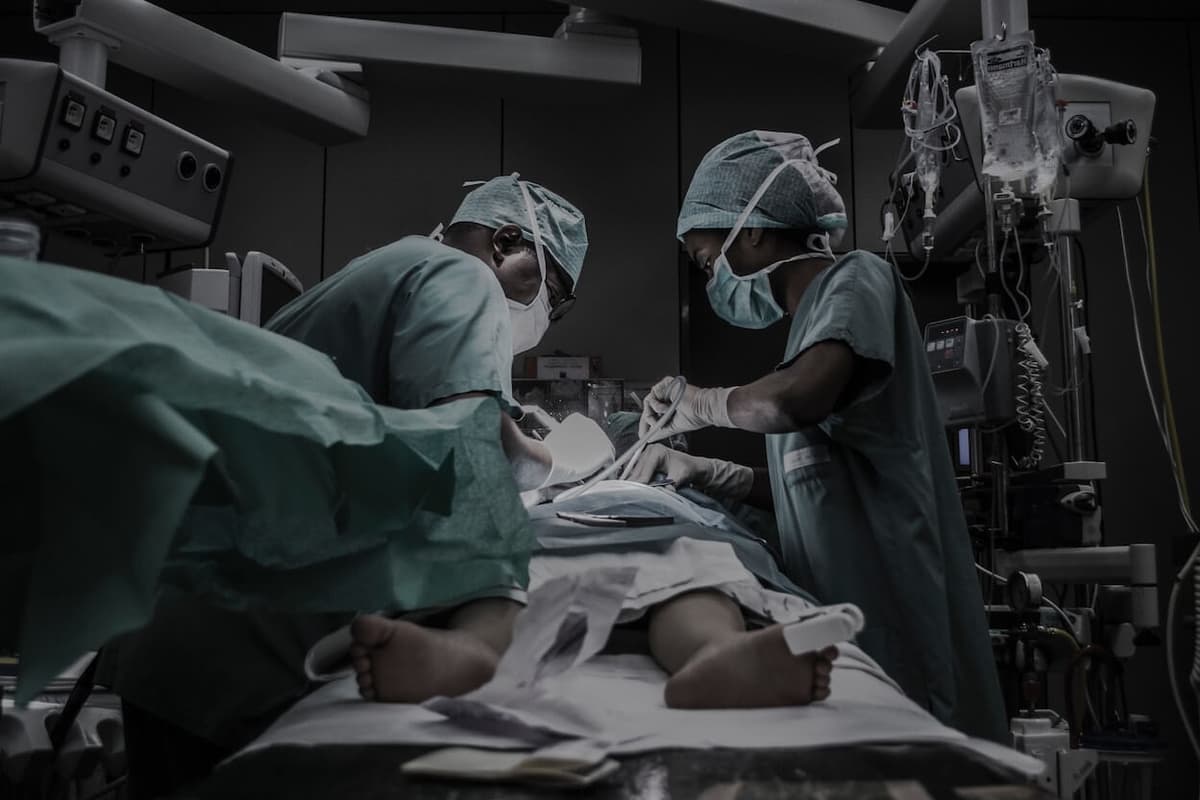 Surgeons performing medical procedure in operating room